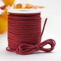 DIY dark red faux suede cord wound on a white spool for Christmas gift wrapping - Korean Leather Cord - Bright Red