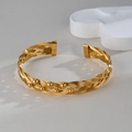 Golden woven mesh open bangle featuring polished gold beads on a minimalist stone base - Gold