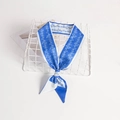 Elegant Klein blue and white floral silk twilly scarf tied in a bow on a white grid - Blue White Floral