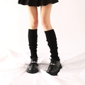 Women's black knitted leg warmers with vertical ribbed texture and slouchy style - One Size / Black