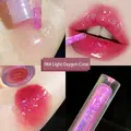 Water gloss lip glaze in 06 Light Oxygen Coral with shimmering purple particles - 06# Light Oxygen Coral