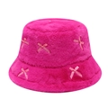 Fuzzy pink bucket hat with ribbon bows and soft plush texture on white background - One Size / Rose Red