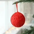 6cm red wool felt Christmas ball ornament hanging on a green pine branch with warm lights - Spherical (AQMR2-5) / Single Piece / Red