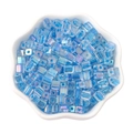 5mm blue iridescent square glass sugar beads in a white ceramic floral bowl - Dark Blue
