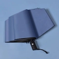 Automatic folding UV umbrella in Morandi blue with matte finish and black logo handle - 8-Rib Automatic / Haze Blue