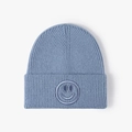 Blue knit beanie with ribbed texture and smiley face embroidery on the folded cuff - One Size / Grey Blue