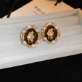 Detail of vintage French gold stud earrings featuring portrait relief and pearls - Pearl Enamel Portrait Oval Earrings
