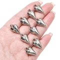 Detailed view of silver heart charms held in hand to demonstrate size for DIY jewelry - Pointed Heart / 11x19mm (Hole approx 2mm) - 10pcs/pack / Silver
