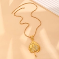 Detailed view of gold maple leaf pendant with sparkling rhinestones on a long chain - Golden Style (03 Imitation Gold DZ-653)