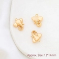 Vista macro di ciondoli a elefante dorati 12x14mm per accessori di gioielli fai da te - Testa di Elefante