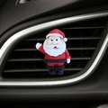 Detailed view of a Santa Claus car air vent clip accessory on a black interior vent - Large Santa Claus