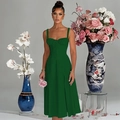 Detailed close-up of dark green French vintage sundress with lace-up corset waist design - Green
