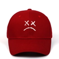 Dark red baseball cap featuring a white embroidered sad boy face on a classic six-panel crown - Burgundy