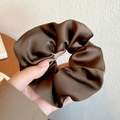 Minimalist brown satin scrunchie with a luxurious silk texture for women's hair styling - Brown
