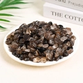 Polished dark smoky quartz and obsidian crystal stones displayed in a white ceramic dish - Smoky Quartz (9-12mm) 100g