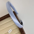 Detailed view of light blue satin headband texture with handmade inner label - Blue Gold