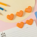 Set of five bright orange heart-shaped plastic clips for paper and office organization - Orange