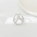 Close-up of three interlocking silver rings on a white ceramic plate for silk scarf styling - BZ238-3 Silver 3-Ring Geometric Triangle