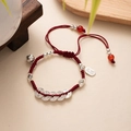 Detail of red braided hand rope with silver coin charms and peace tag in Neo-Chinese style - L393-5 Five Ancient Coins (Red Rope)