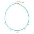 Detail view of sky blue beads and gold star pendants on a bohemian style necklace - Sky Blue Beads-Star Flare Pendants