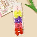 Set of 10 handmade grosgrain ribbon bow clips in pink, yellow, purple, red, and orange - Style 15