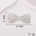Detailed view of silver bow charm with sparkling rhinestones, size 5.5cm x 2.5cm - Alloy / D580 Full Rhinestone Bow Tie White