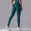 Dunkelgrüne High-Waist Seamless Scrunch Butt Yoga-Leggings für Fitness und Formung - Nachtgrün