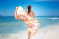 Ethnic style orange and yellow geometric beach scarf draped by a model at the sea - Style 16-Orange Yellow Geometric Print / 180cm