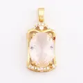 Gold-plated alloy pendant featuring a large oval pink zircon in a vintage hollow frame - Clear/Oval