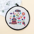 Round tortilla warmer pouch with Chilean folk art illustration and black hanging loop - Chile Culture