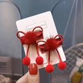 Detail of handmade red bow hair clips with pom-poms and tassels on a display card - Wine Red (1 Pair BB Clips)