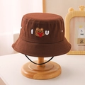 Close-up of brown kids bucket hat with bear embroidery and black windproof lanyard - 54cm(3-10 Years) / Brown