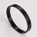 Close-up of black stainless steel bracelet with Greek key pattern and inlaid diamonds - 8mm / Black