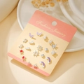 Titanium steel stud earrings set featuring silver bow and star motifs on card - Silver Butterfly Rainbow (E1914-1)