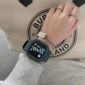 Detail of dark green square digital watch on wrist with silver rings and tote bag - Dark Green