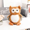 Brown and white owl plush toy with polka dot wings on a cozy home background - 25cm / Brown