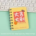 Yellow A7 spiral notebook with lucky orange graphic and 80 blank pages for kids - Good Luck