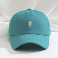 Detailed close-up of white daisy embroidery on a teal cotton baseball cap for summer - Lake Blue