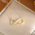 Elegant gold infinity necklace with white cubic zirconia set on a premium jewelry box - A0107 Gold Infinity