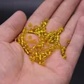 Vibrant 2mm yellow glass seed beads for DIY jewelry making held in hand for scale - 4mm / 15g / Gold Yellow