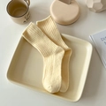 Pale yellow ribbed wool socks for women in soft autumn colors displayed on a tray - One Size / Light Yellow