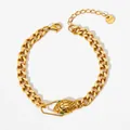 Gold stainless steel Cuban chain bracelet with emerald eye snake head clasp detail - Gold