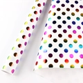 White gift wrapping paper featuring vibrant holographic polka dots in a convenient roll - 50x70cm / Holographic Rainbow Dots