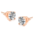Close-up of rose gold four-prong stud earrings with round-cut clear cubic zirconia - 3mm White Stone / Rose Gold