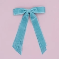Detail of teal blue velvet hair clip with long double ribbons on pink backdrop - Lake Blue