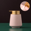 Pink speckled ceramic soap dispenser with a gold pump and close-up of usage - Straight / Pink with Gold Pump