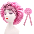 Close-up of pink satin sleep cap with adjustable long ribbons and bow detail - Cross-Rose Pink