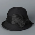 Detail of elegant black woven cloche hat featuring a large decorative silk bow on the side - M (56-58cm) / Black