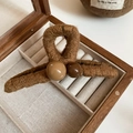 Close-up of vintage hair claw clip with woven fiber texture and decorative resin beads - Dark Coffee Woven Bead Style