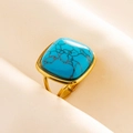 Detailed close-up of a vintage adjustable gold ring with a square blue turquoise stone - Gold Base-Dark Blue Stone